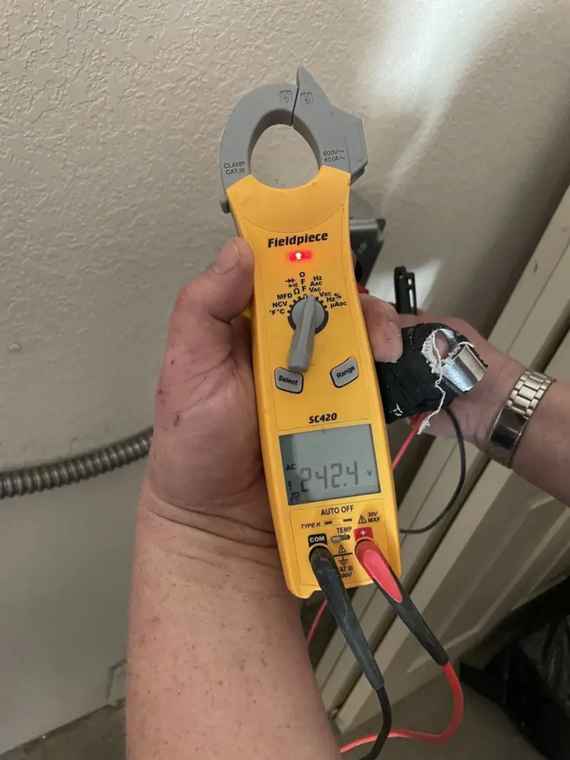 Voltage testing with clamp meter during Circuit Breaker Repair in Ludlow